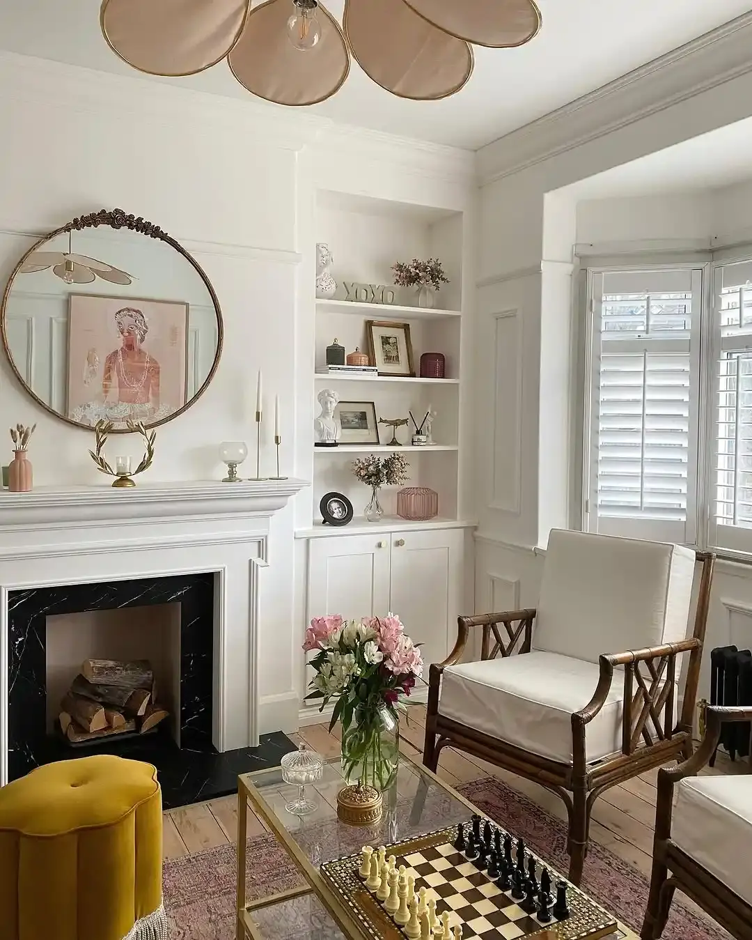 White Full Height Shutters in a bright living room with fireplace