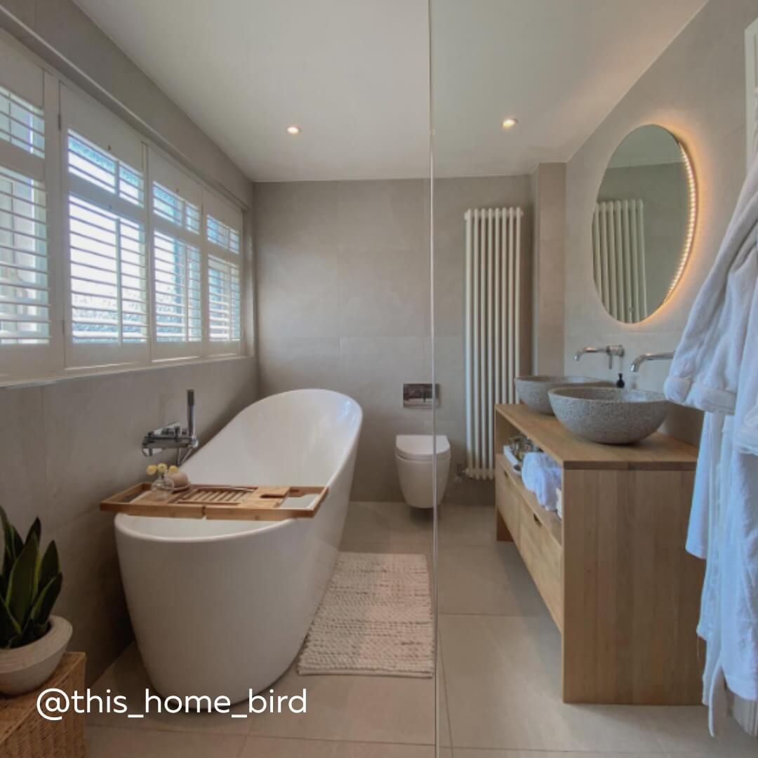 White Full Height Shutters with midrail in a modern spa style bathroom with freestanding bathtub