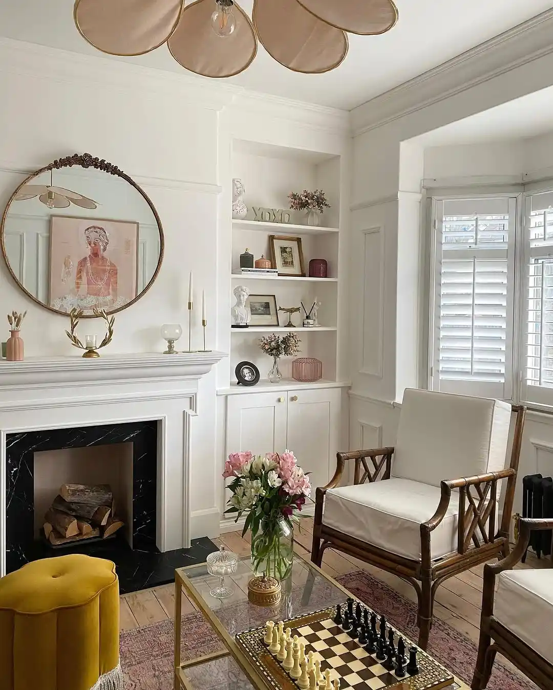White Full Height Shutters in a bright living room with fireplace