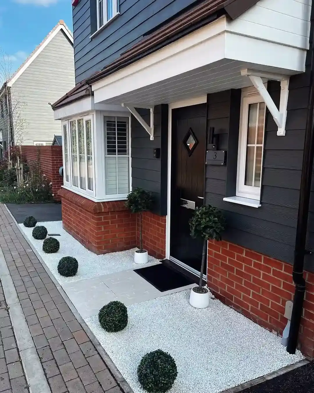 Exterior view of White Full Height Shutters in a modern home
