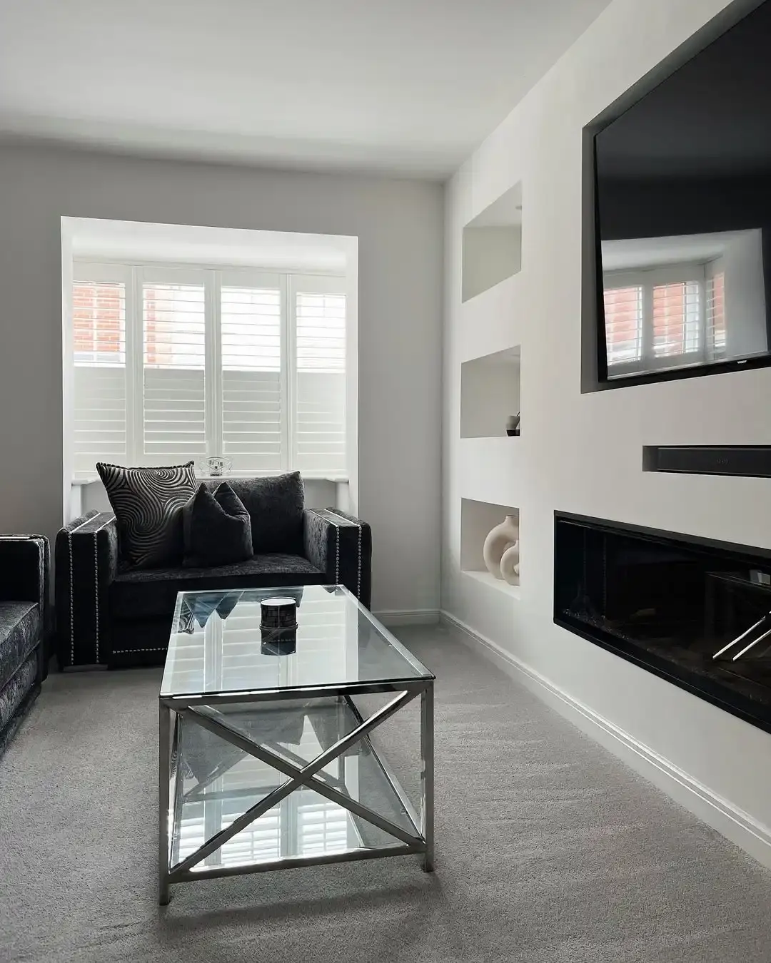White full heights shutters with top panel louvres open in modern living room