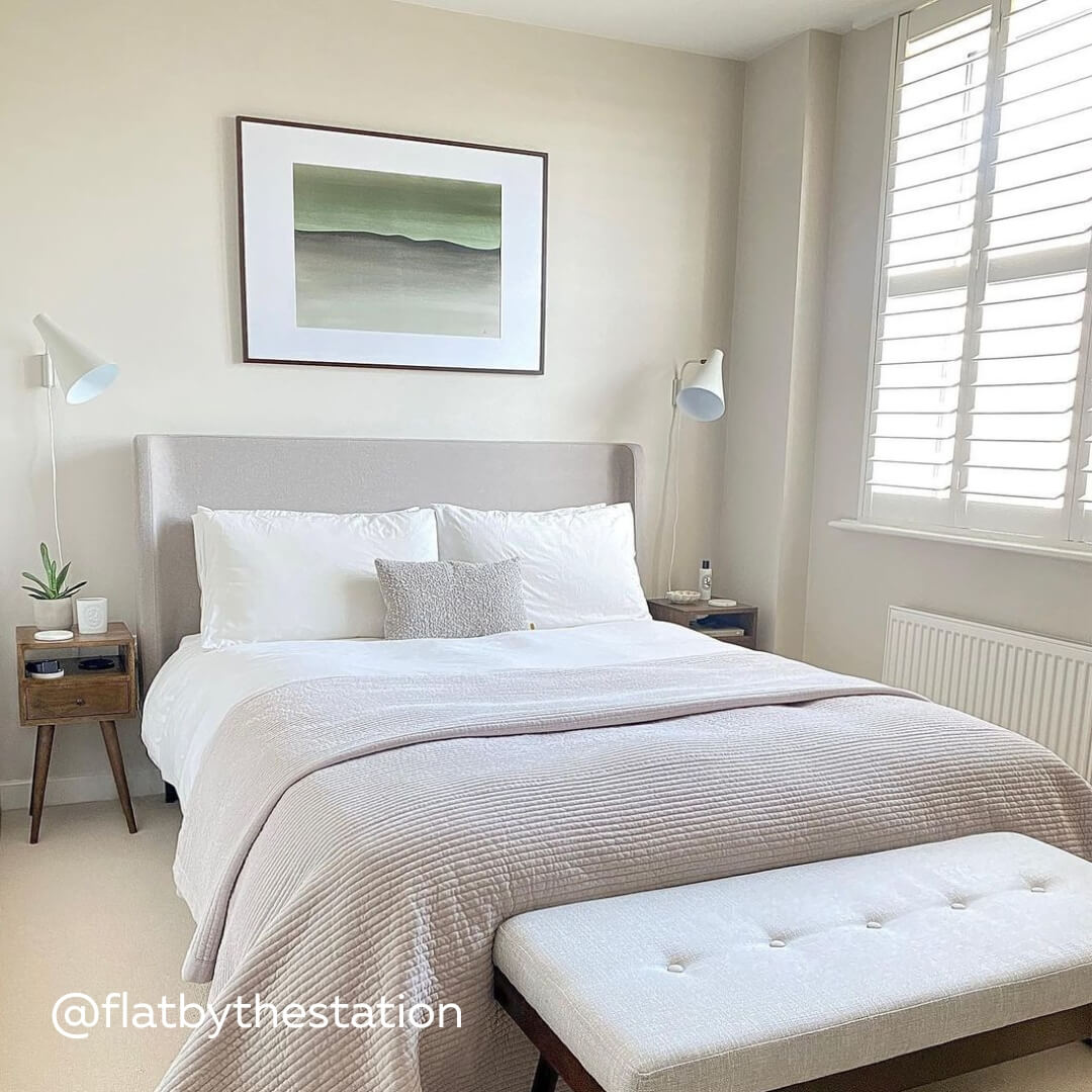 White Full Height Shutters with midrail in light and bright bedroom