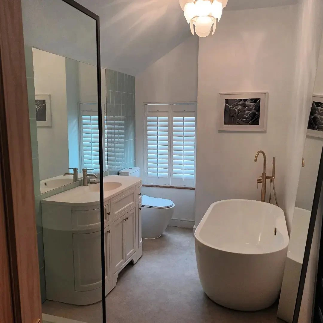 White full height shutters in modern bathroom