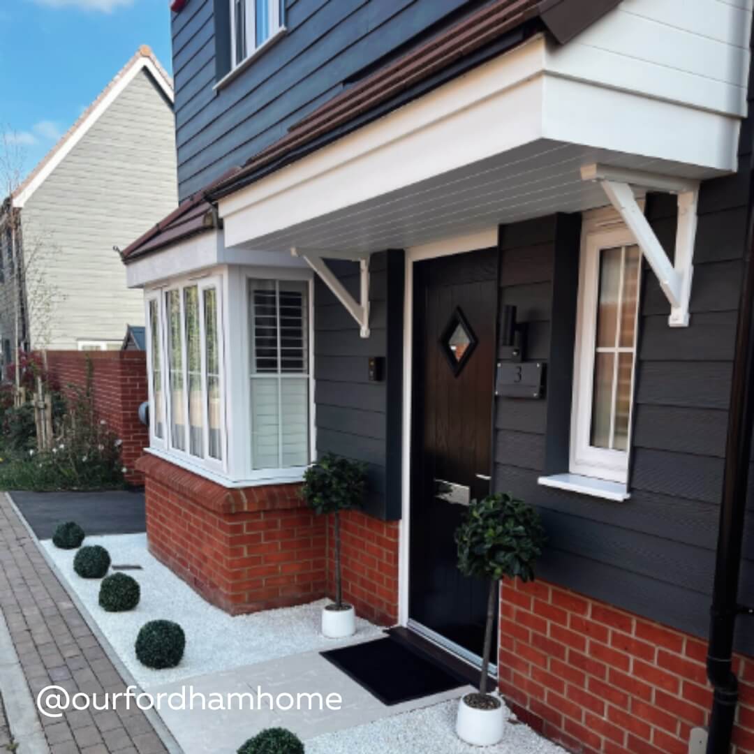 Exterior view of White Full Height Shutters in a modern home 