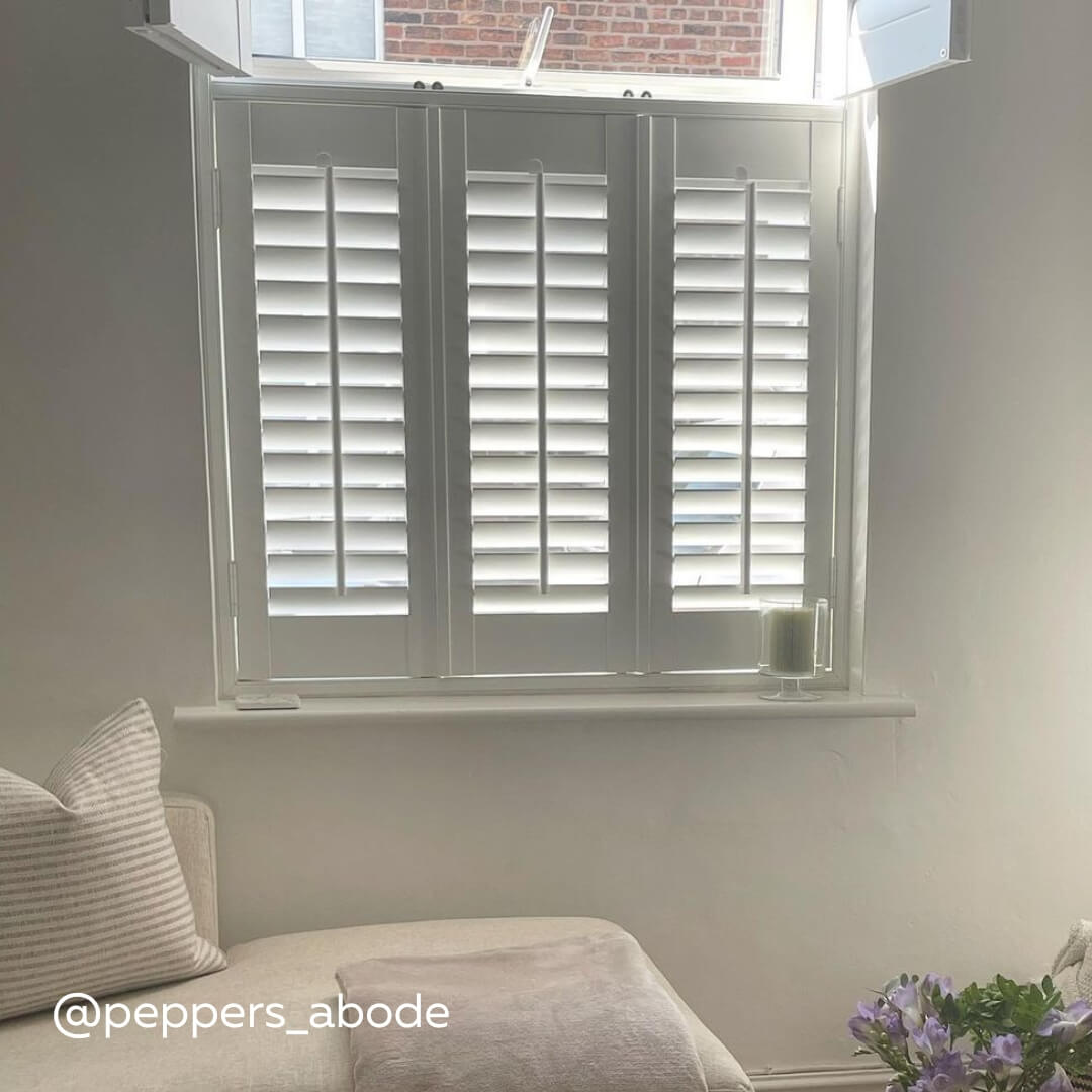 White Full Height Shutters with narrow panels in a classic white styled home 